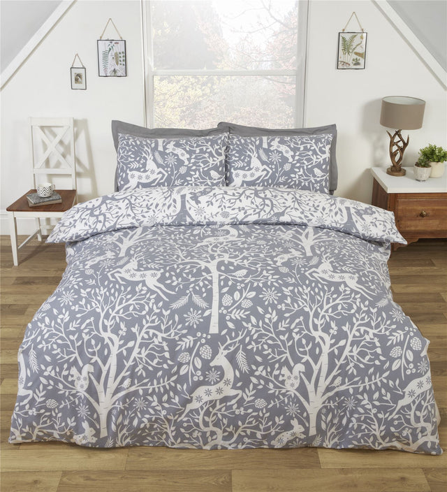 Leaping stags among trees and shrubbery on the Tatton Duvet Set 