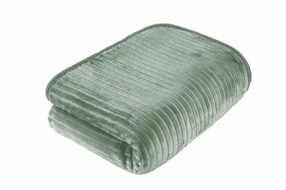 Luxurious ribbed faux fur throw adding a pop of colour to a minimalist bedroom setting