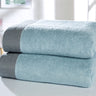 Soft and absorbent bath towel featuring textured herringbone edging for stylish bathroom decor