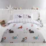 Adorable winter-themed dog breeds wearing festive sweaters, bobble hats, and scarves on the duvet cover