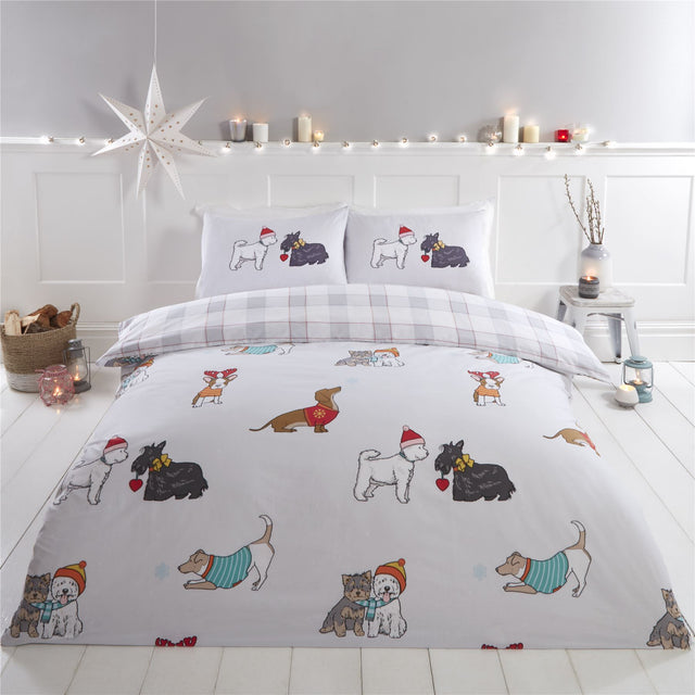 Adorable winter-themed dog breeds wearing festive sweaters, bobble hats, and scarves on the duvet cover