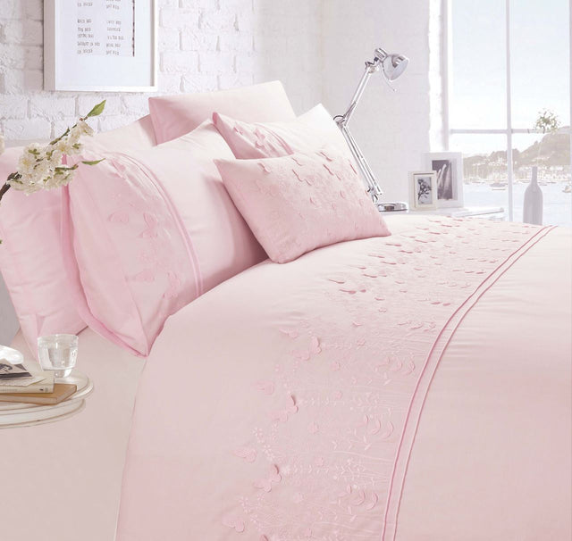 A beautifully embroidered Papillon Boudoir Cushion featuring intricate butterfly detailing in white fabric
