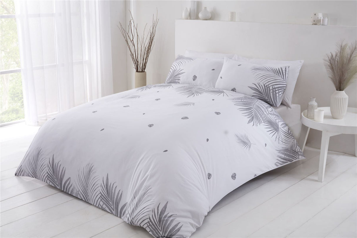 King-sized duvet cover adorned with bold tropical leaves, crafted from sustainable materials for eco-conscious bedrooms