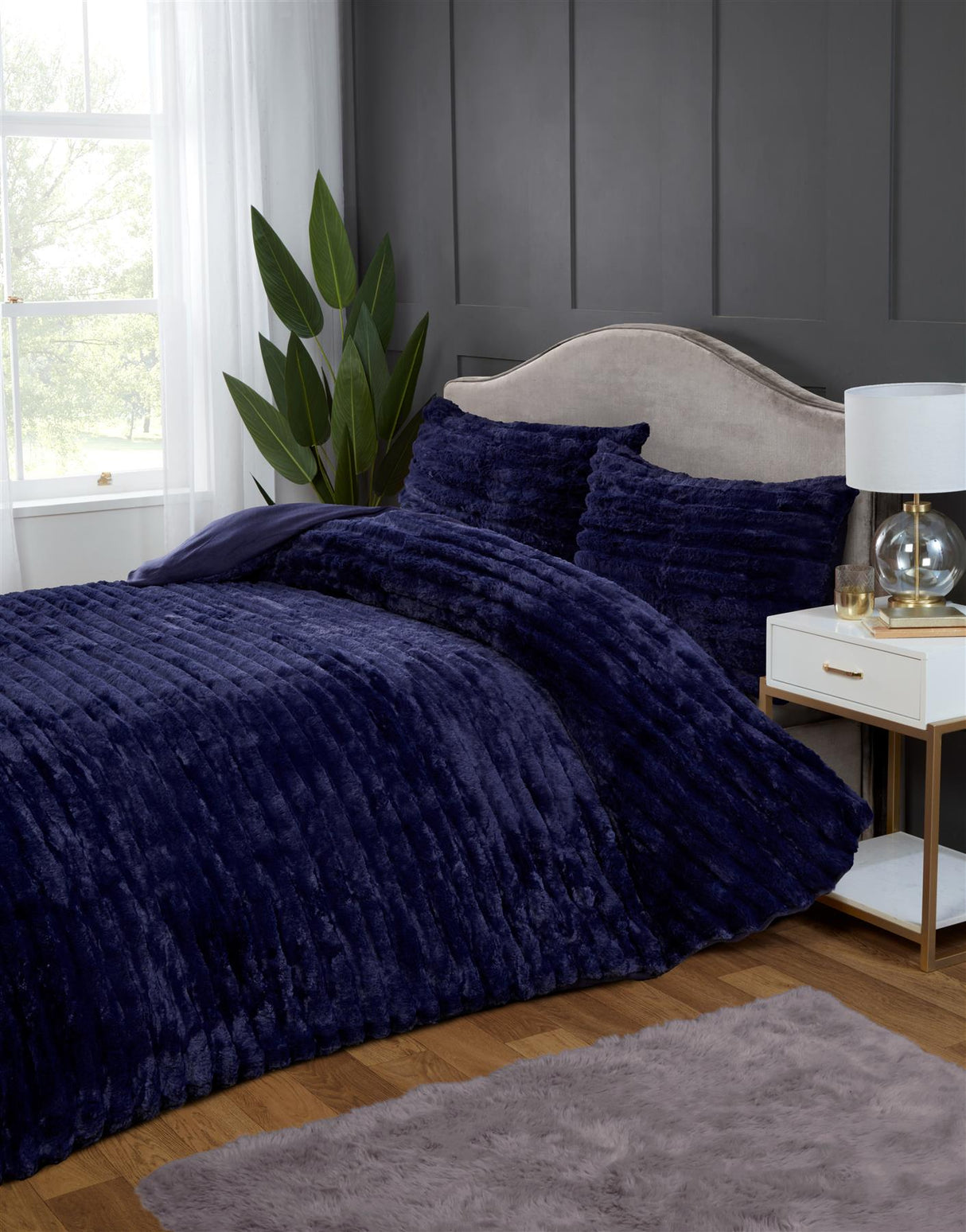 Wide shot of a bed dressed with the rabbit faux-fur duvet set, creating an inviting and sumptuous retreat