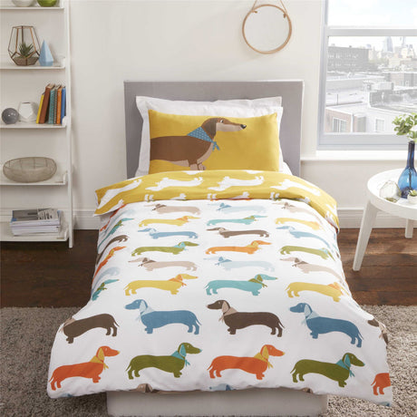 Close-up of sausage dog design on the reversible duvet cover with coordinating pillowcases showing playful stretched sausage dogs