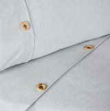 Elegant waffle-design duvet cover featuring stripe patterns and a subtle horizontal border with button accents