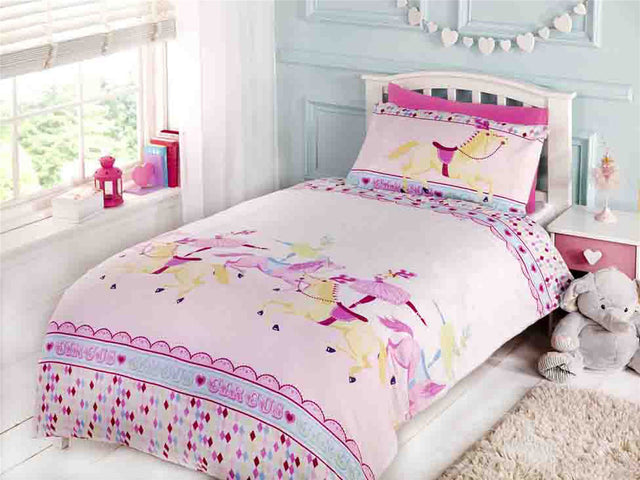 A colourful duvet set featuring carousel horses and the word 'circus' printed in pink shades, with a matching pillowcase displaying a carousel horse design