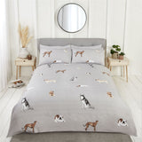 Stylish duvet set featuring hand-drawn dogs on textured ground with reversible striped reverse