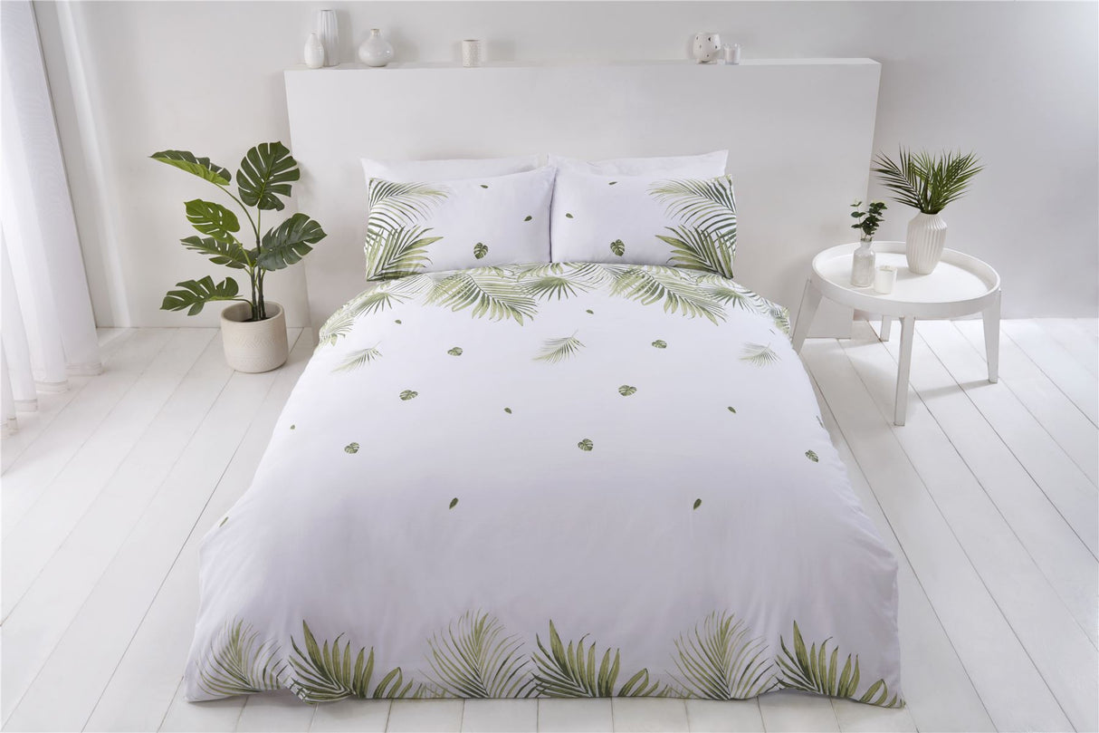 Bright tropical leaf design on the front of the sustainably sourced cotton and recycled polyester duvet cover