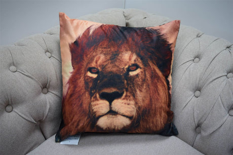 A vibrant photographic velvet cushion showcasing a majestic wild lion's face in detailed, colourful imagery measuring 43x43cm