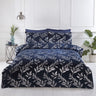 Luxurious navy-blue Como Duvet Set featuring silver foil printed leaf designs with matching pillowcases