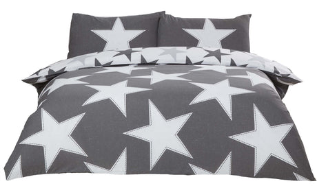 Reversible bedding set with bold star design on one side and smaller stars on the other, including matching pillowcases